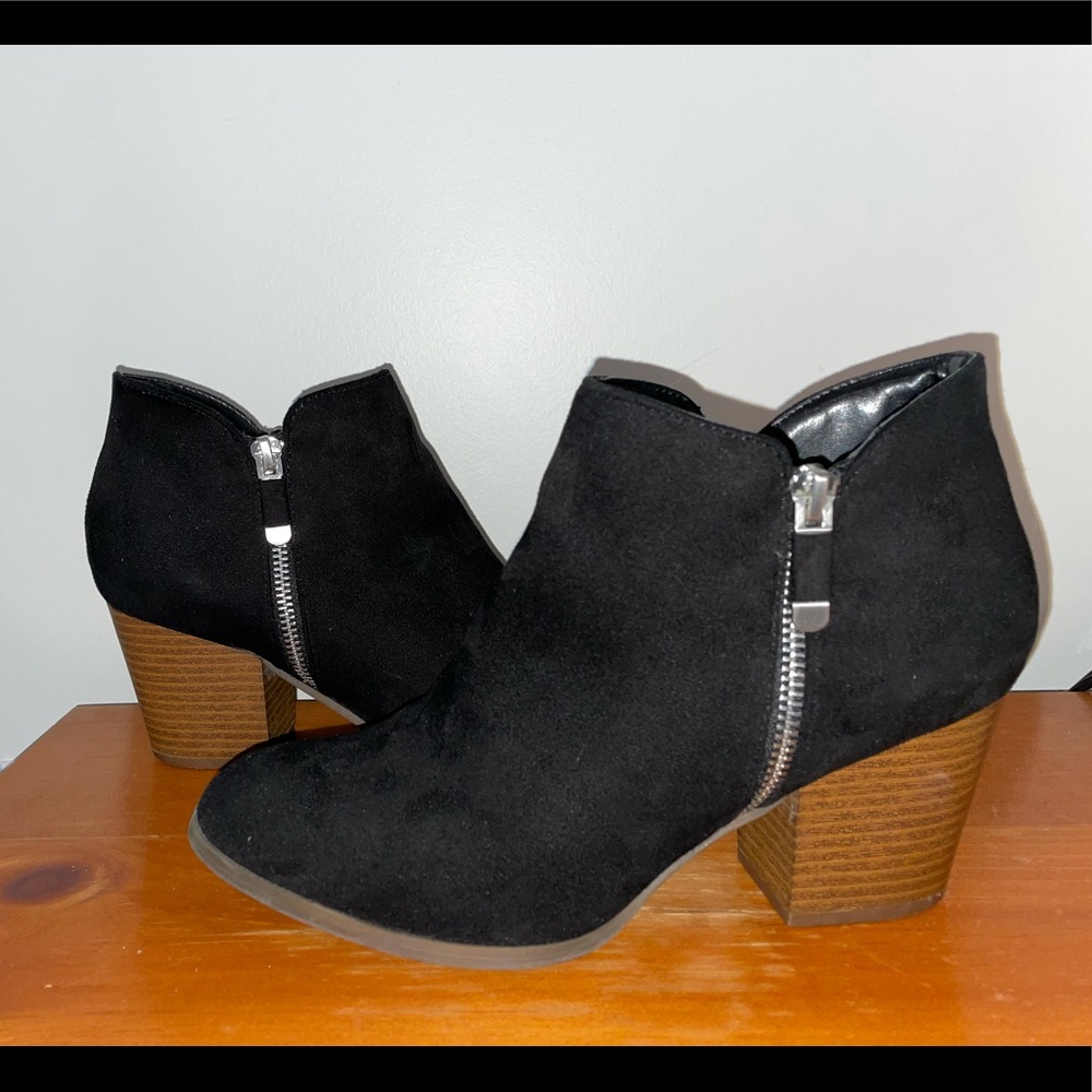 Black suede booties with wood heel and silver zipper detail
